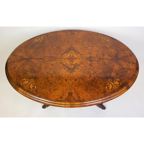 813 - A Victorian walnut oval inlaid breakfast table