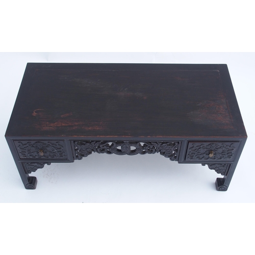 818 - A pair of Chinese hardwood low tables