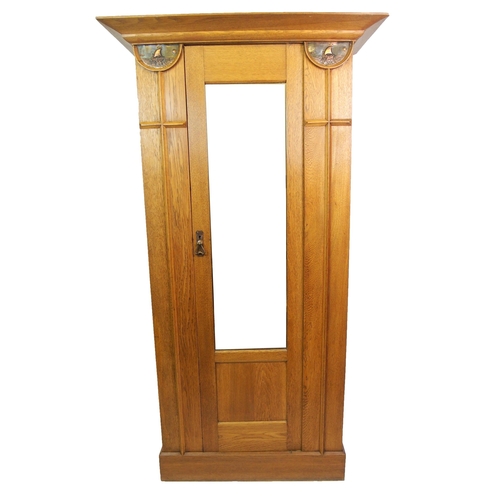 825 - An Arts and Crafts oak wardrobe