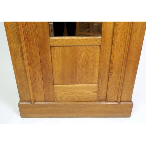 825 - An Arts and Crafts oak wardrobe