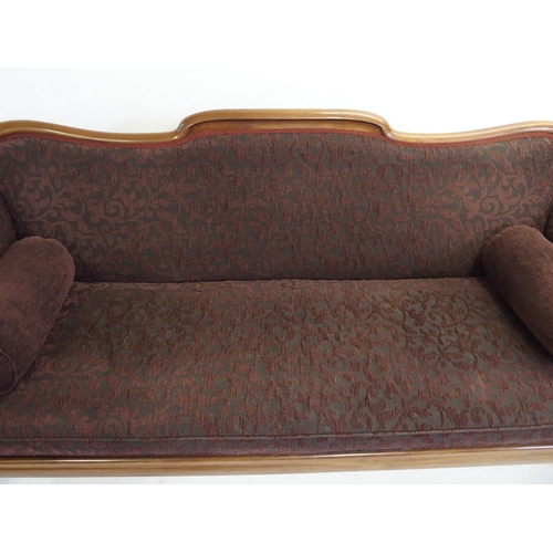 833 - A Victorian mahogany framed scroll back settee