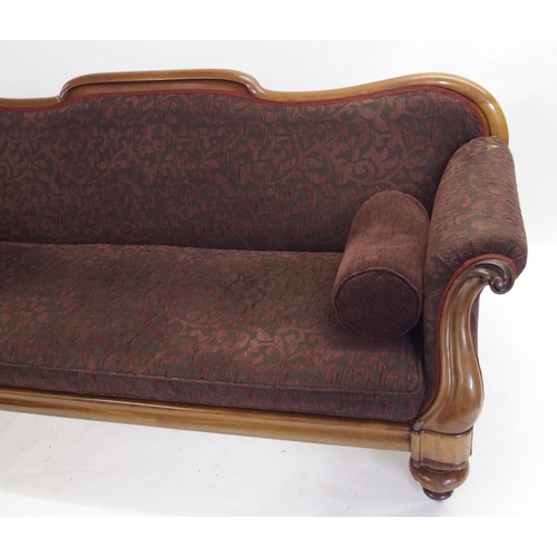 833 - A Victorian mahogany framed scroll back settee