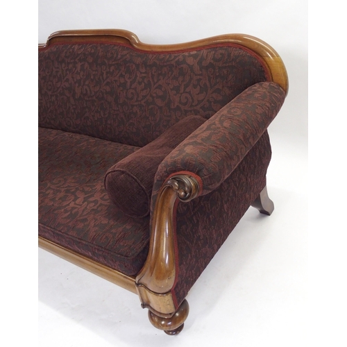 833 - A Victorian mahogany framed scroll back settee