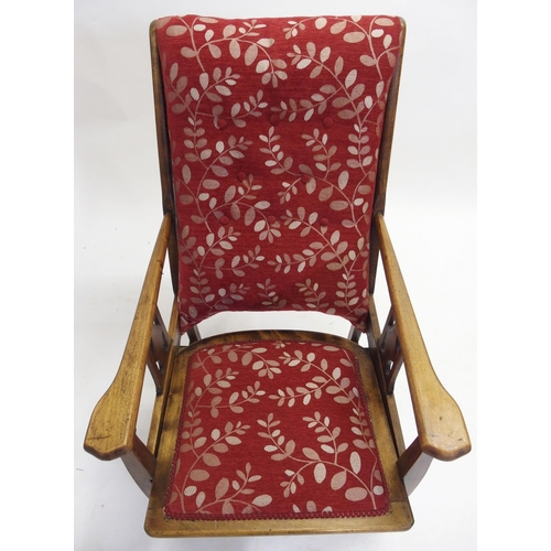 836 - A pair of Liberty style upholstered armchairs