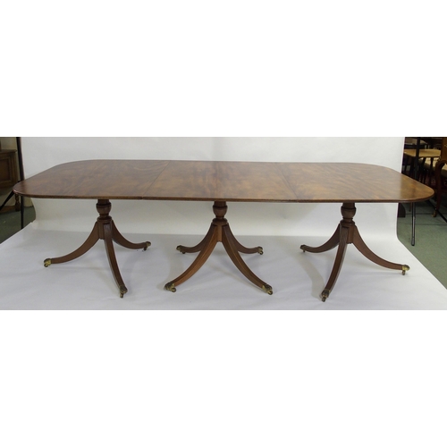 838 - A mahogany triple pillar D-end dining table