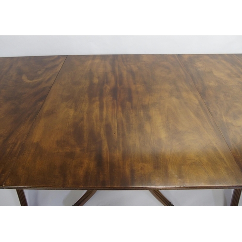 838 - A mahogany triple pillar D-end dining table