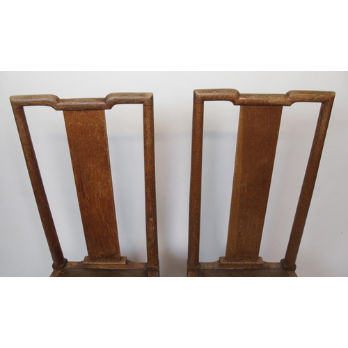 839 - A set of twelve oak Arts and Crafts dining chairs