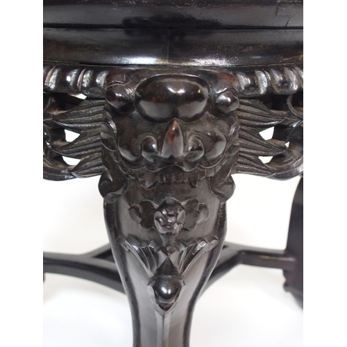 842 - A Chinese hardwood circular pedestal