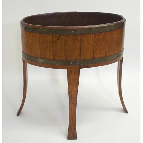 847 - An oak staved and brass bound oval planter