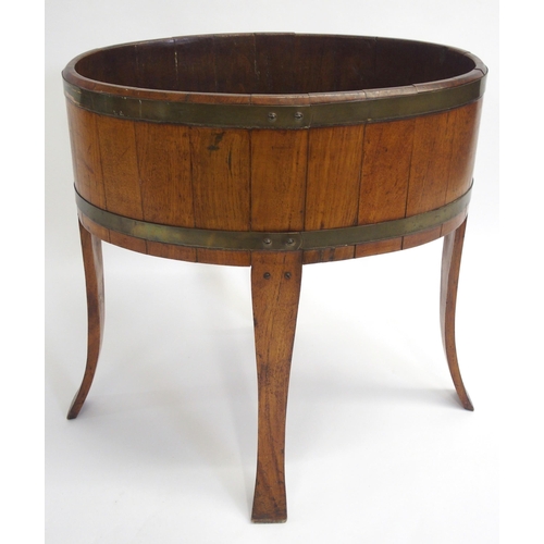 847 - An oak staved and brass bound oval planter