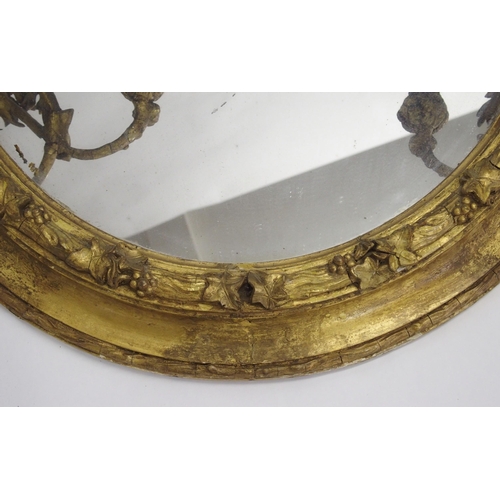 848 - A Victorian giltwood and gesso oval wall mirror