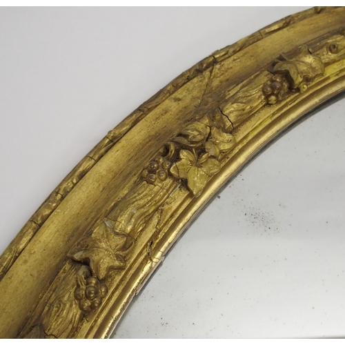 848 - A Victorian giltwood and gesso oval wall mirror