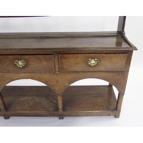 849 - An oak dresser and rack