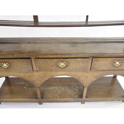 849 - An oak dresser and rack