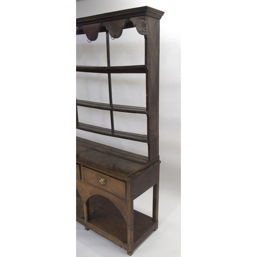 849 - An oak dresser and rack