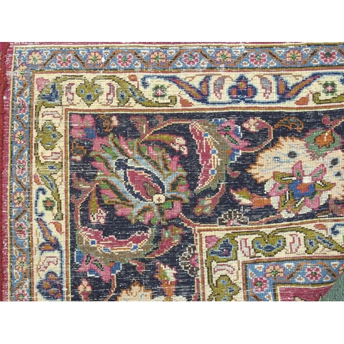 867 - A red ground Meshed rug