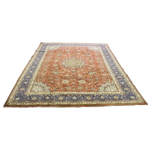 869 - A red ground Sarough rug