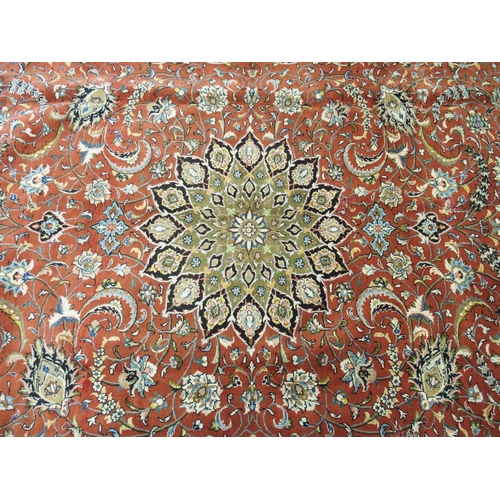 869 - A red ground Sarough rug