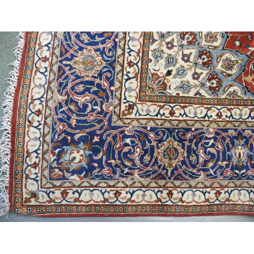 869 - A red ground Sarough rug