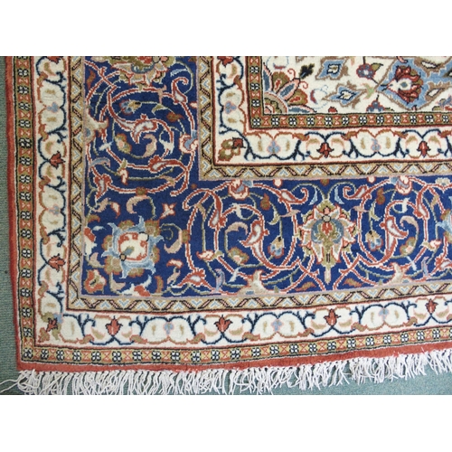 869 - A red ground Sarough rug