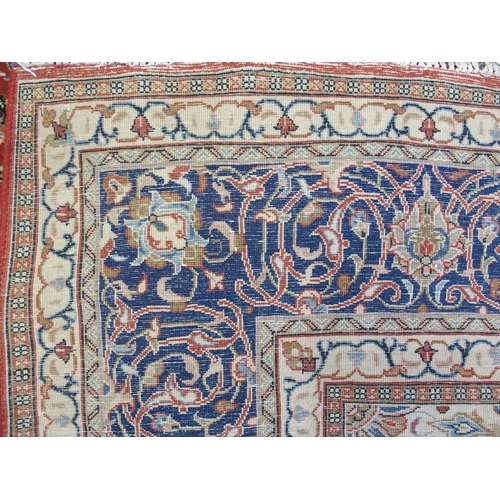 869 - A red ground Sarough rug