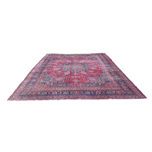 871 - A red ground Safi Ali Shah rug