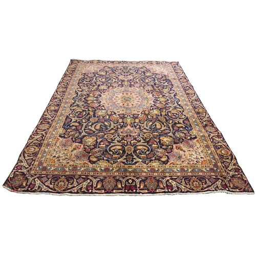 873 - A blue ground Meshed rug