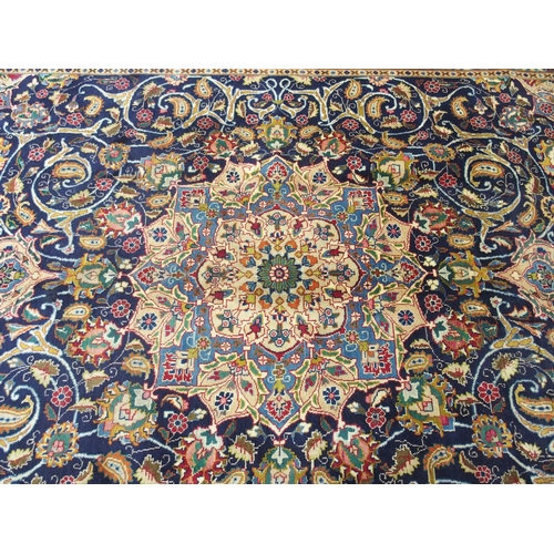 873 - A blue ground Meshed rug