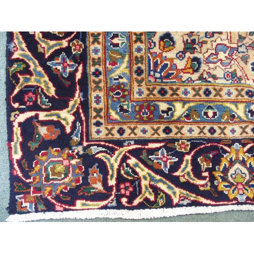 873 - A blue ground Meshed rug