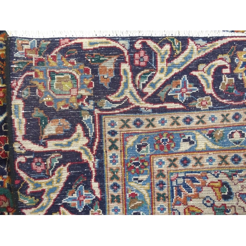 873 - A blue ground Meshed rug