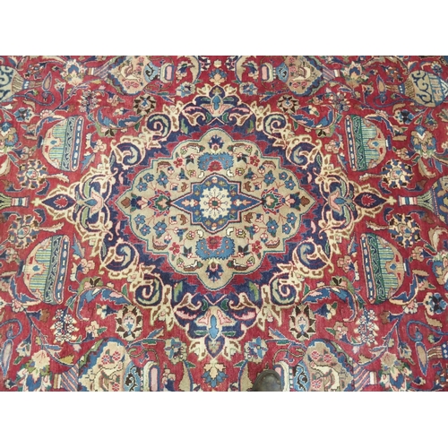 874 - A red ground Meshed rug