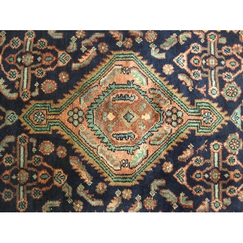 875 - A blue ground Hamadan rug