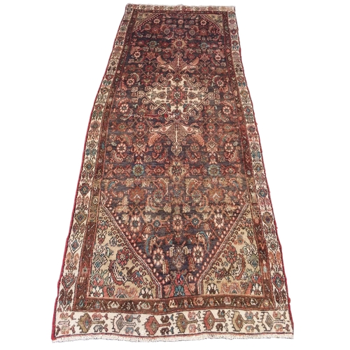 876 - A brown ground Hamadan runner