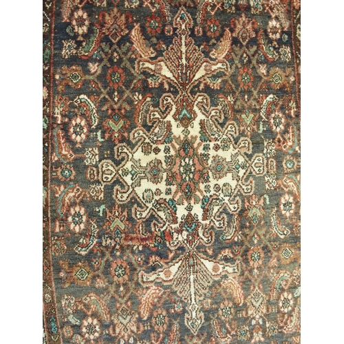 876 - A brown ground Hamadan runner