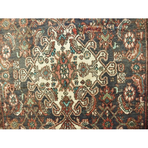 876 - A brown ground Hamadan runner