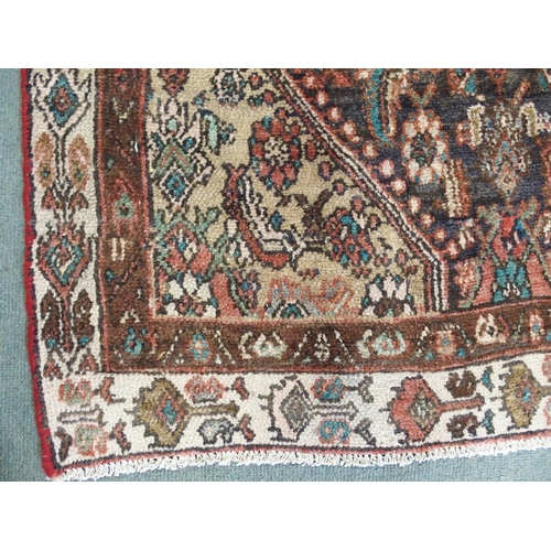 876 - A brown ground Hamadan runner