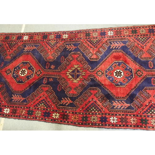 877 - A red and blue ground Malayer runner