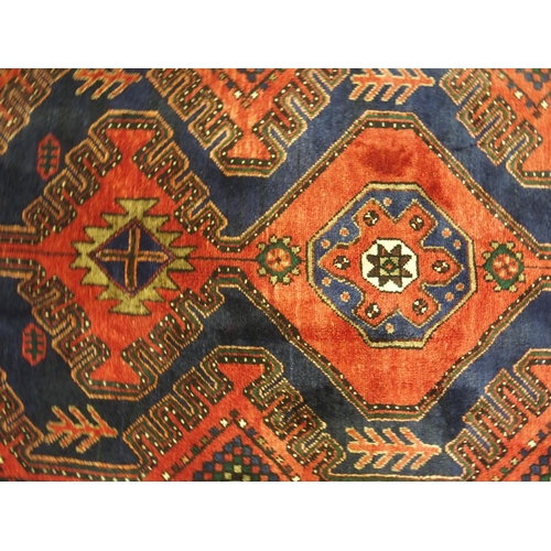 877 - A red and blue ground Malayer runner