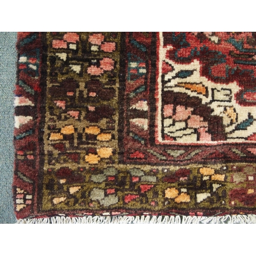 879 - A Terracotta ground Hamadan runner