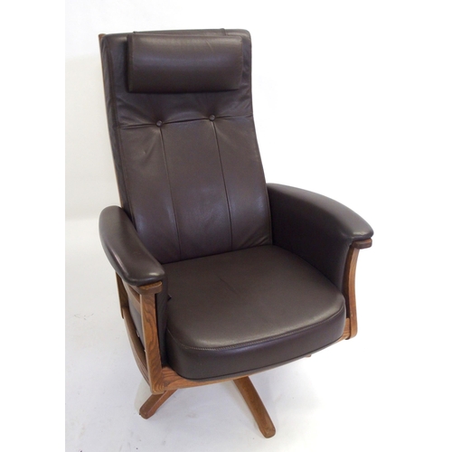 888 - An Ercol brown leather golden dawn Gina recliner chair