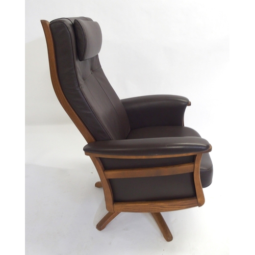 888 - An Ercol brown leather golden dawn Gina recliner chair