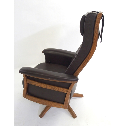 888 - An Ercol brown leather golden dawn Gina recliner chair