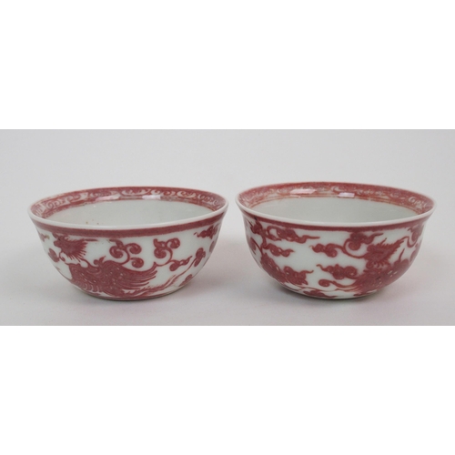 99 - A pair of Chinese copper red teabowls