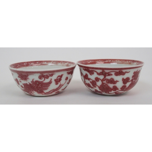 99 - A pair of Chinese copper red teabowls