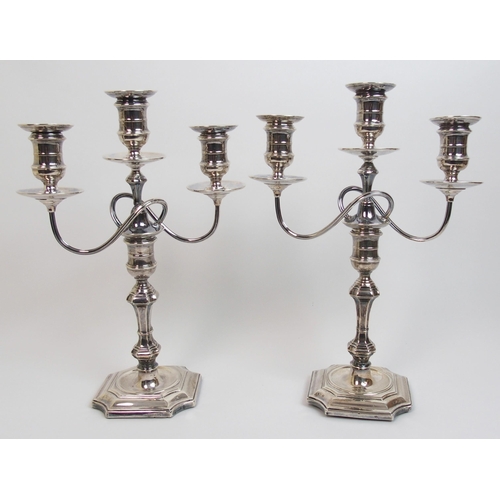 152 - A pair of early 20th Century silver candelabra