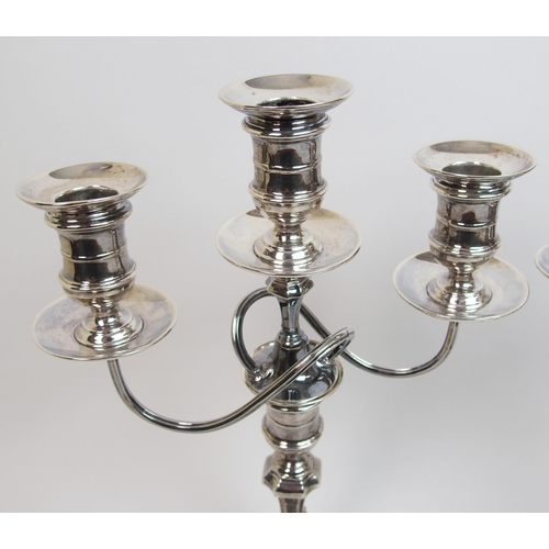 152 - A pair of early 20th Century silver candelabra