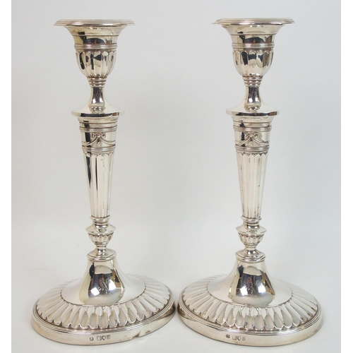 163 - A pair of late Victorian silver candlesticks