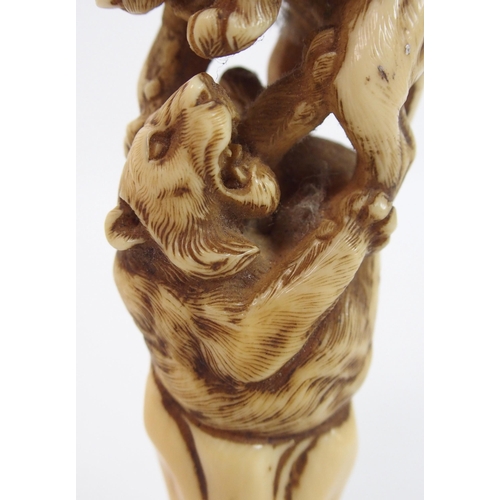 28 - A Japanese carved ivory cane handle