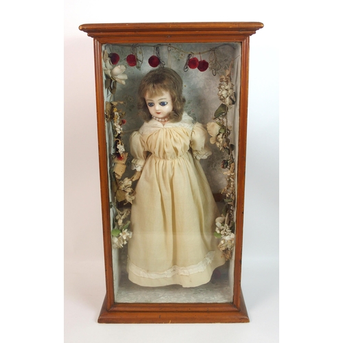 316 - An early wax over doll