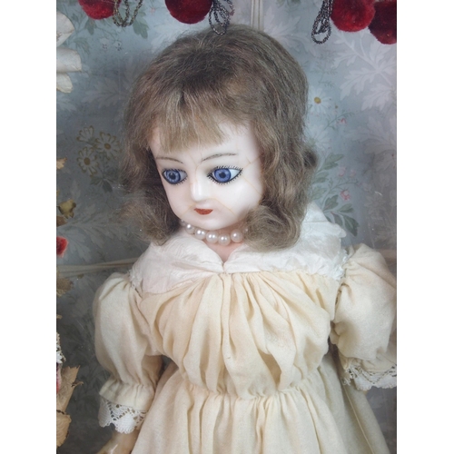 316 - An early wax over doll